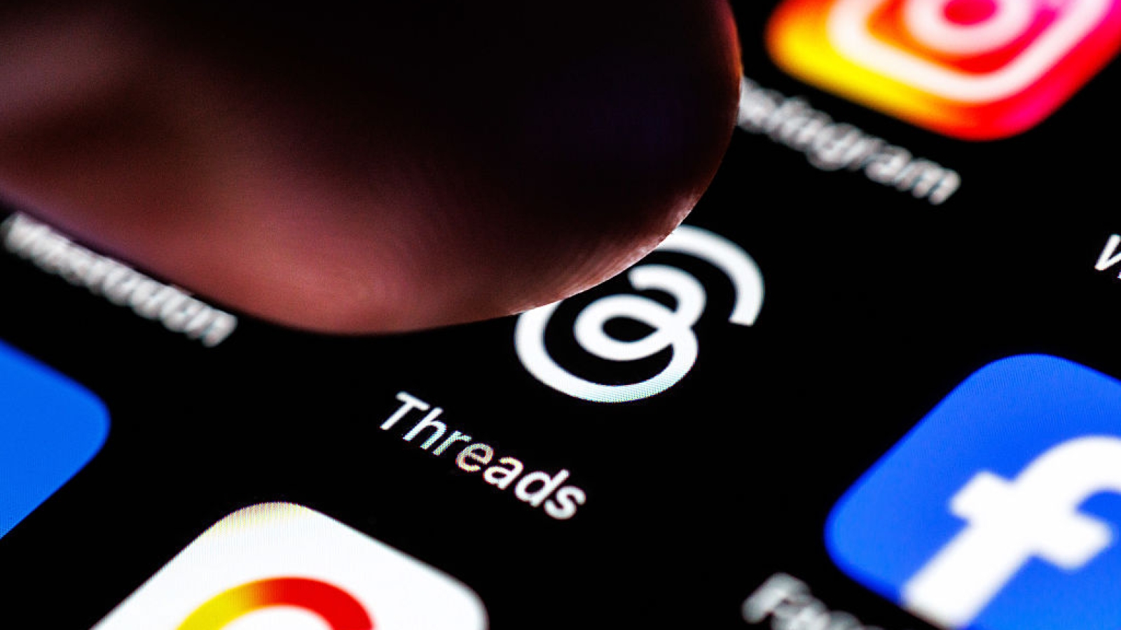 02 September 2025, Lower Saxony, Norden: The logo of the Threads app can be seen on the display of a smartphone on September 2, 2025, while an index finger approaches the application's icon. Threads is a text-based social media platform from Meta (the company behind Instagram) that allows users to have public conversations and create posts in the form of "threads" (social network, social media, icon image, icon photo, illustration, iconic photo, illustrative photo, theme image, general image, theme photo) Photo: Matthias Balk/dpa (Photo by Matthias Balk/picture alliance via Getty Images)
