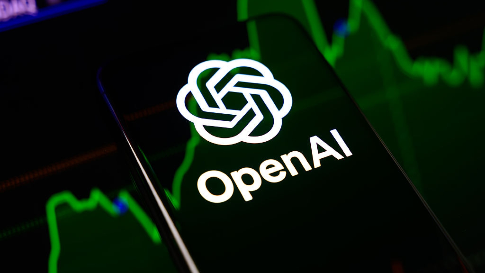 The OpenAI logo is displayed on a smartphone screen placed on a reflective surface onto which a stock market chart is projected, in Creteil, France, on June 9, 2026. OpenAI confirms that it has confidentially filed a prospectus for an initial public offering (IPO) with the Securities and Exchange Commission (SEC). (Photo by Samuel Boivin/NurPhoto via Getty Images)